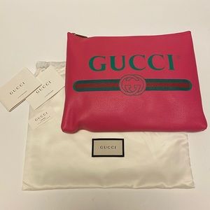SOLD New Gucci pink leather print zip clutch
